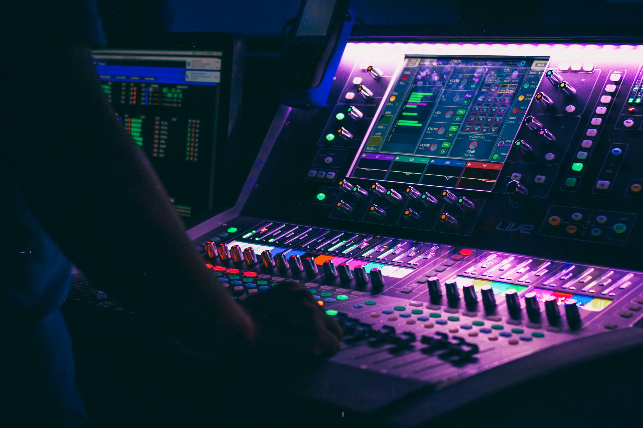 Person controlling a mixing console