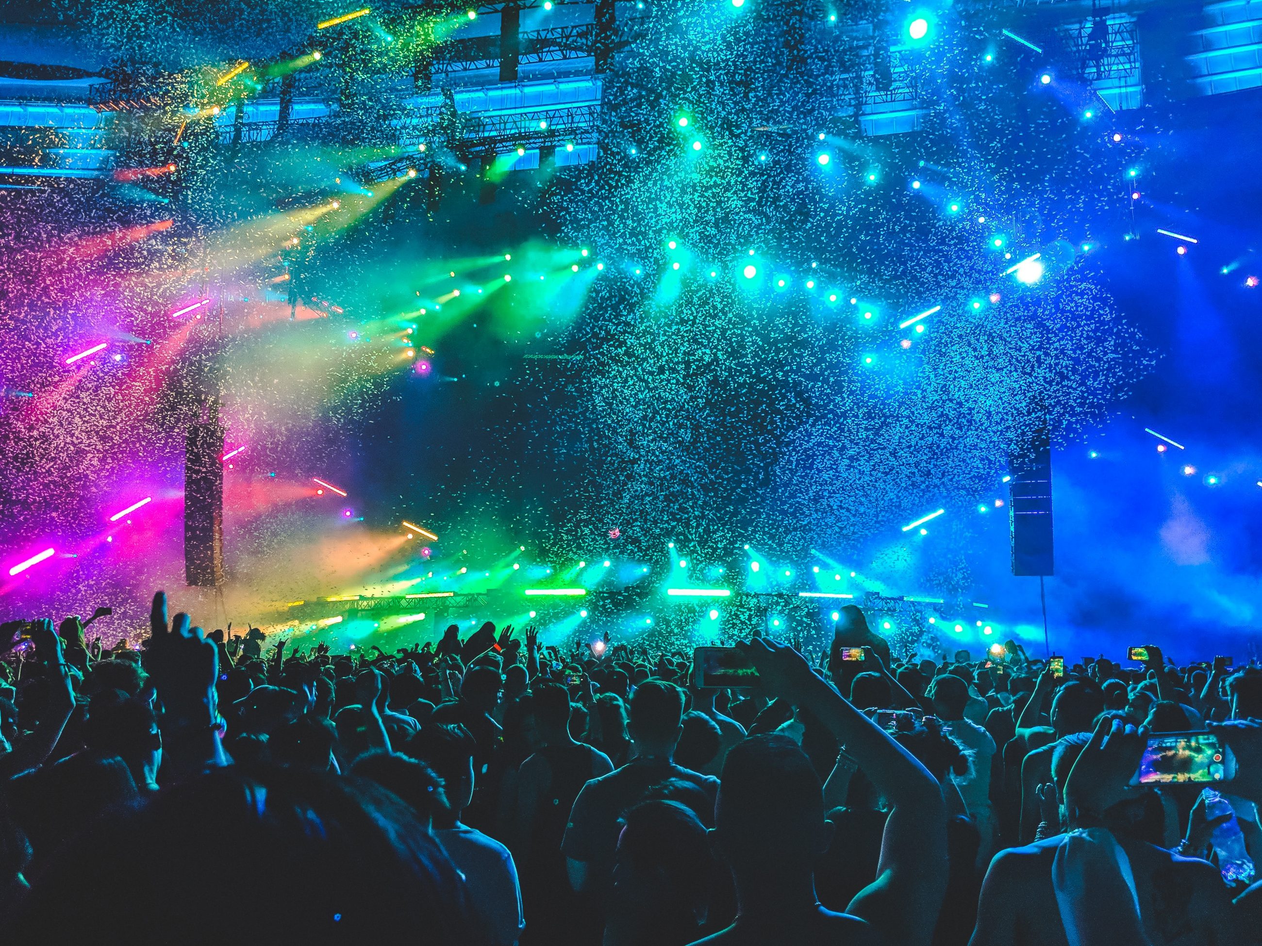 group of people in front of the stage at a music festival