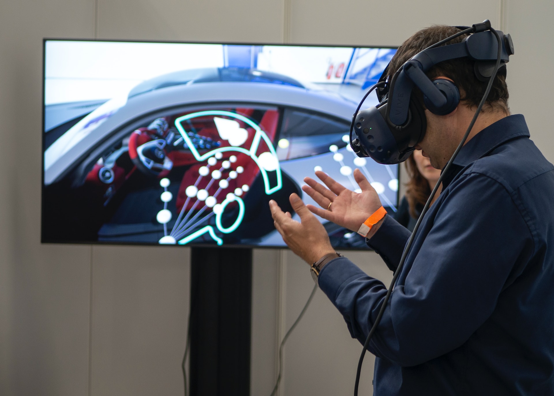 man in black jacket using a virtual reality headset and playing a virtual reality game