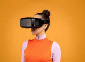 woman wearing a vr headset, watching concerts created by music metaverse companies