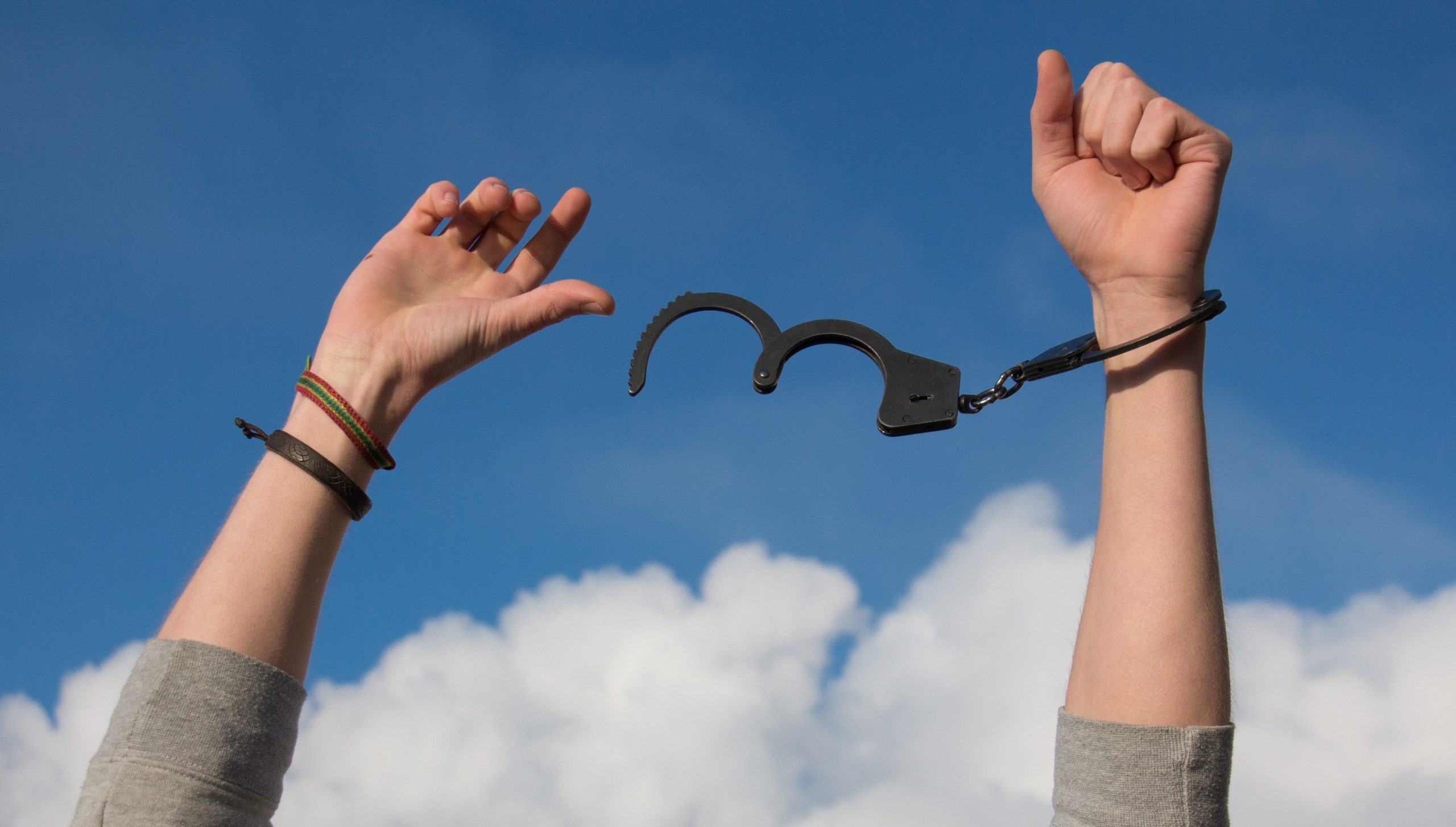 arms breaking free from handcuffs