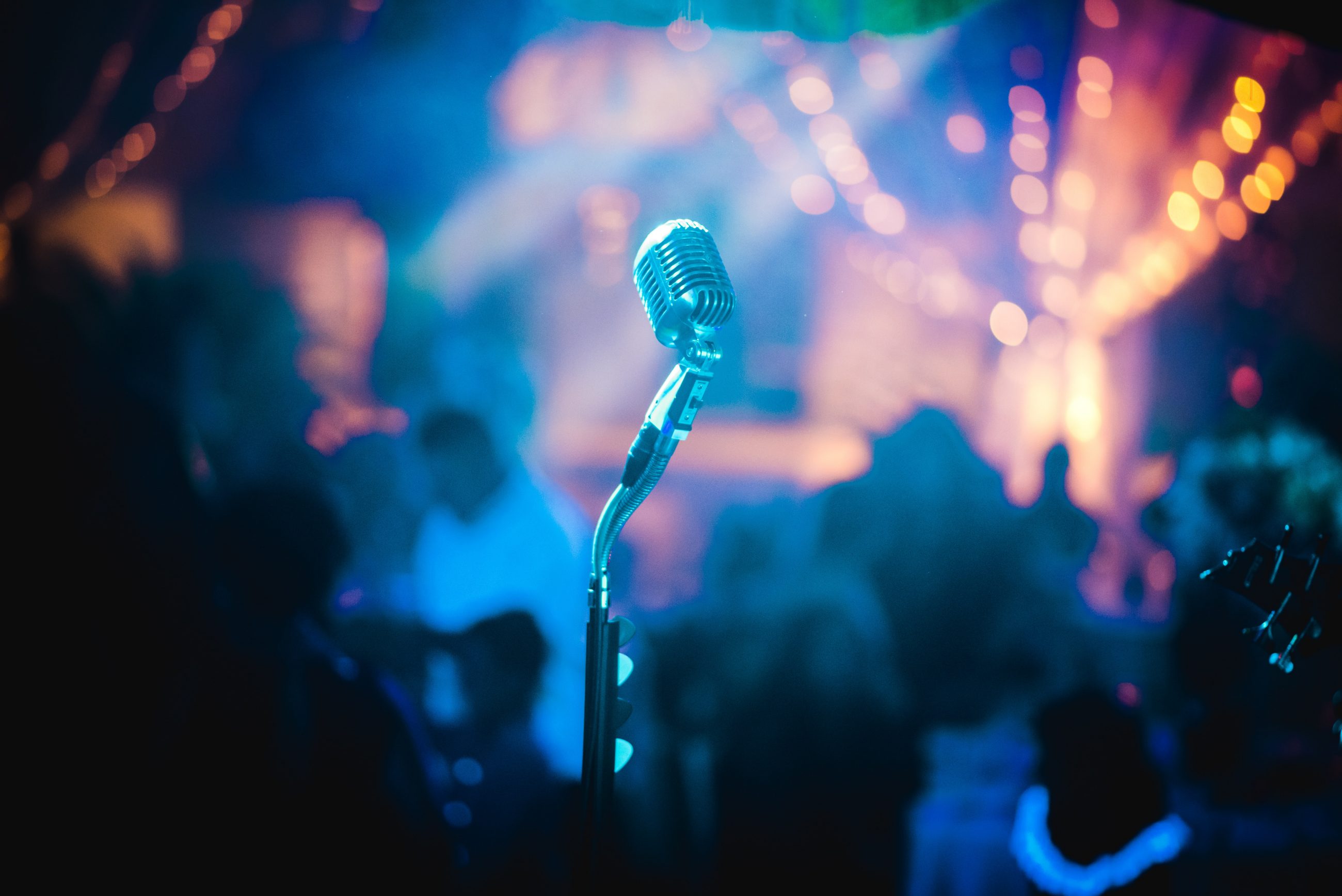 grey microphone inside a music venue during a music event