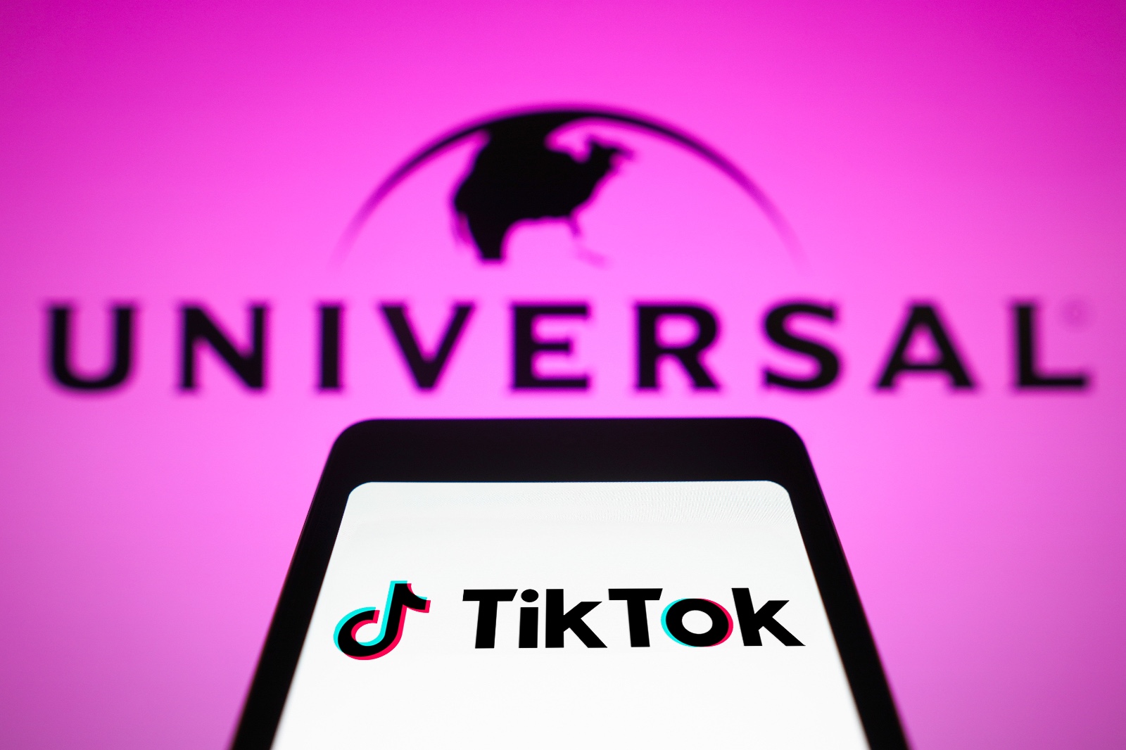 Tiktok logo at the front, Universal logo at the back